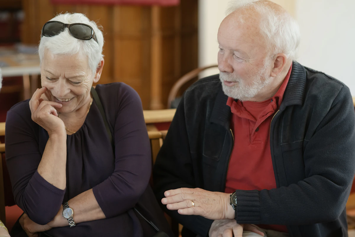 An older couple sharing a relaxed conversation