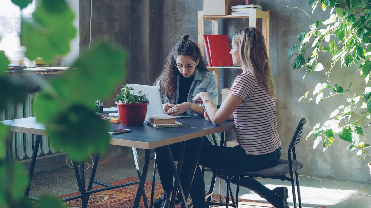 Two colleagues turning ideas into a plan at a desk